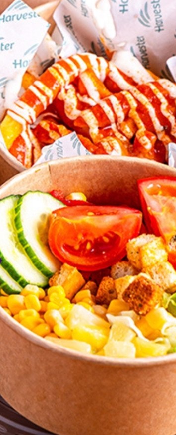 A takeaway bowl of chicken, sweetcorn and salad
